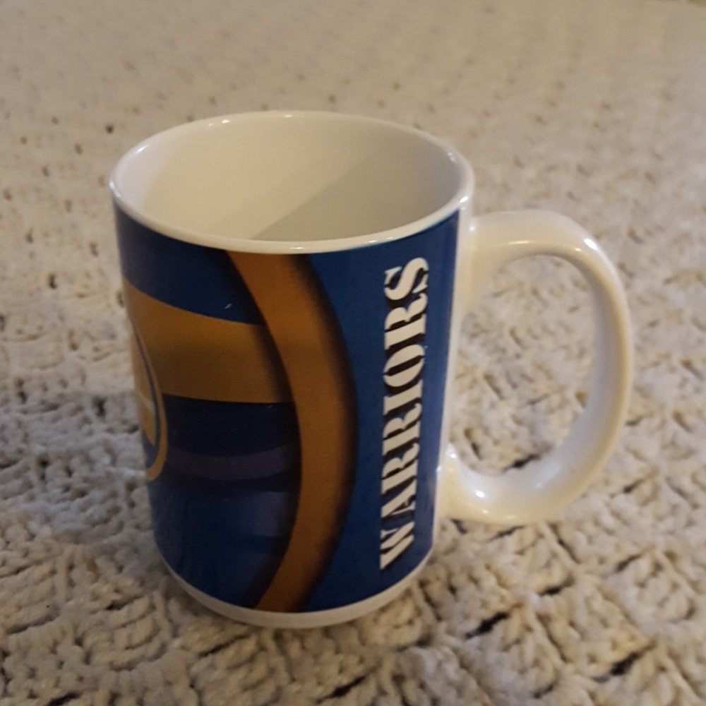 Golden State Warriors mug and brim hat.